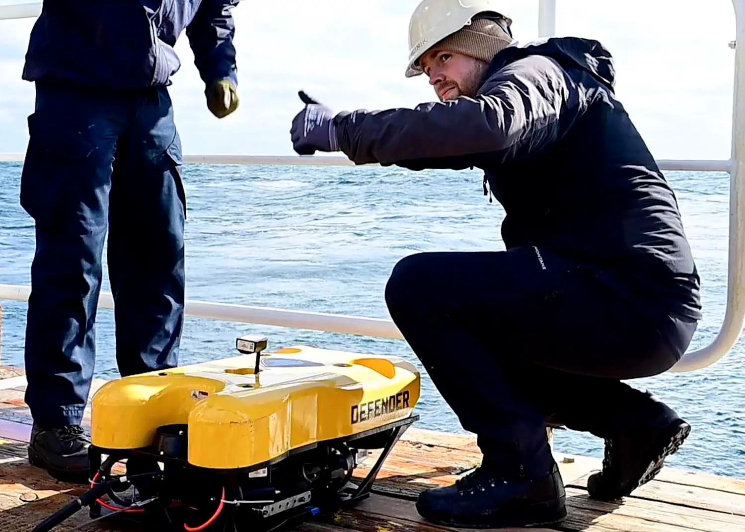 ATLANTIC OCEAN (Dec, 6, 2024) – Royal Australian Navy sailors complete a visual inspection on a Mission Specialist Defender Mark IV remotely-operated vehicle (ROV) aboard the Norwegian-flagged seabed construction vessel MV Island Pride during the Australia, United Kingdom and U.S. (AUKUS) Pillar II Subsea and Seabed Warfare Event Two/Integrated Battle Problem 25.1. During the event, U.S. Navy, Royal Navy and Royal Australian Navy personnel launched, tested and provided demonstrations for several unmanned underwater vehicles, to include the Mission Specialist Defender Mark IV remotely-operated vehicle (ROV) and the IVER4 900 autonomous-underwater vehicle. The AUKUS Advanced Capabilities line of effort – known as Pillar II – is a seminal strategic partnership and technology accelerator for the three AUKUS nations to harness and uplift innovation enterprises and industrial bases, remove barriers to cooperation, and deliver advanced capabilities for AUKUS warfighters. (Image produced utilizing a screen capture from video.) (U.S. Navy photo by Mass Communication Specialist 1st Class Justin E. Yarborough)